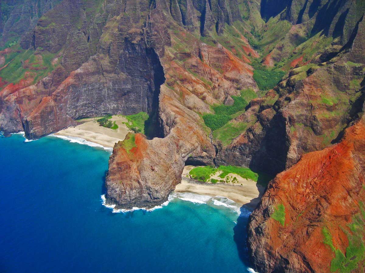 hang-gliding over the hidden beaches of kapaa, hawaii. 