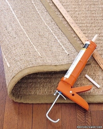 use acrylic-latex caulk to keep rugs from slipping.