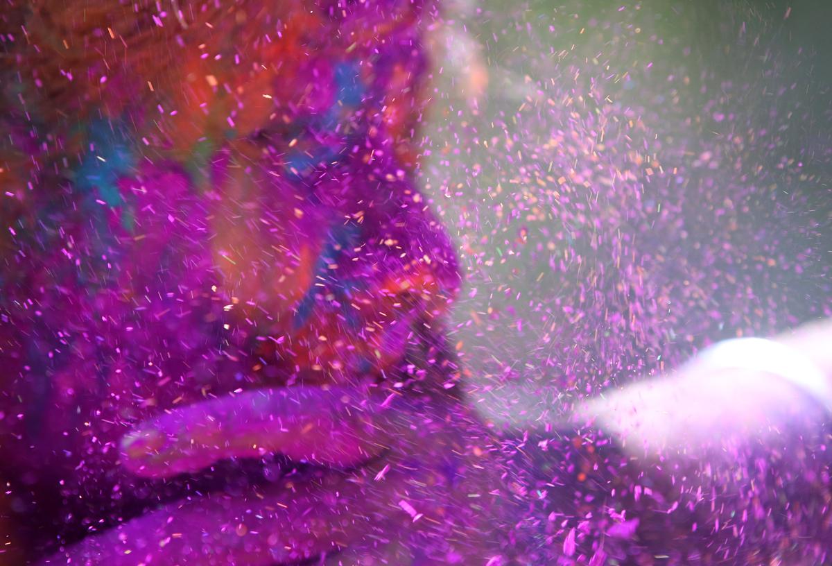 a man smeared the face of a woman with colored powder during celebrations marking holi, the hindu festival of colors, in mumbai on march 6. the streets and lanes across most of india turn into a large playground where people of all faiths throw colored powder and water at each other. (rajanish kakade/associated press)