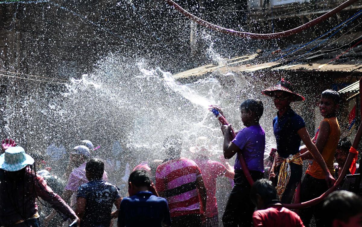 indian children sprayed water as they celebrated holi in allahabad on march 6. (sanjay kanojia/afp/getty images)