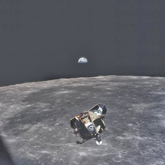 this photo was taken by astronaut michael collins, when he took this photo he was the only human, alive or dead, that wasn’t in the frame of this picture. he travelled with buzz aldrin and neil armstrong and orbited the moon whilst they were landing to study the surface of the moon from farther out.