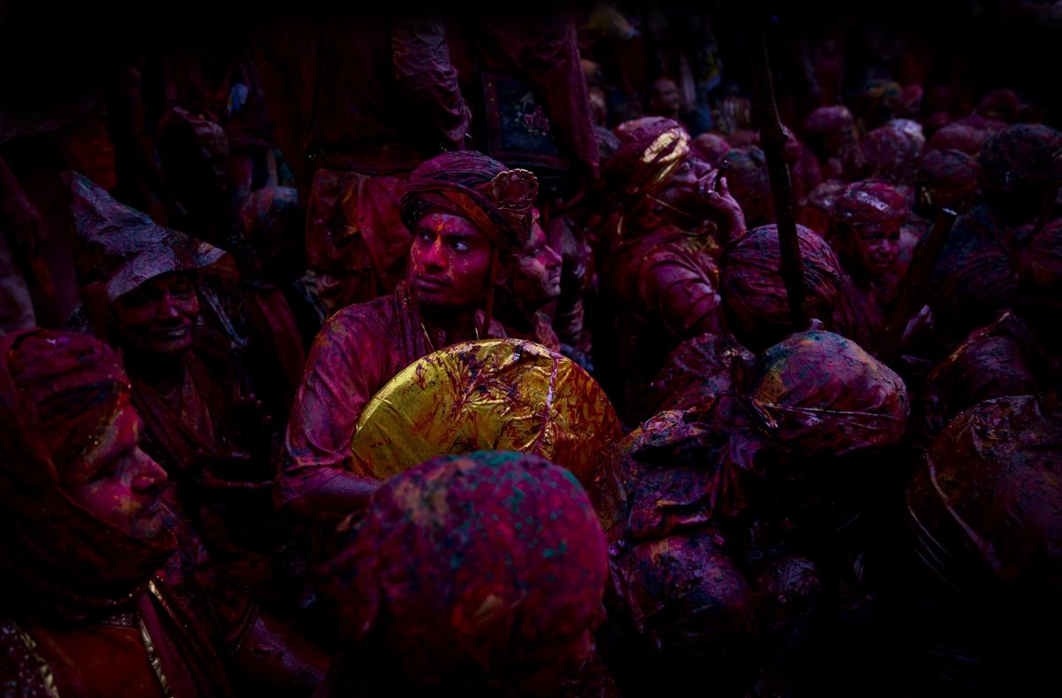 indian hindu devotees smeared with colors visited the nandagram temple, famous for lord krishna and his brother balram, during lathmar holi festival in nandgaon, india, on feb. 28. during lathmar holi the women of nandgaon, the hometown of krishna, beat the men from barsana, the legendary hometown of radha, consort of hindu god krishna, with wooden sticks in response to their teasing as they depart the town. (saurabh das/associated press)