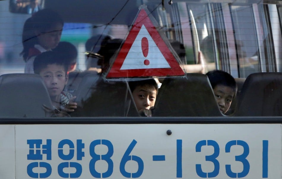north korean students travel in a school bus in pyongyang july 25, 2013. (photo by jason lee/reuters)