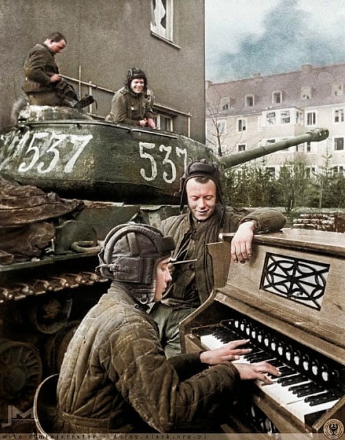crew members of nº537 soviet is-2 tank of the 87th guards heavy tank regiment take a break in breslau (now wrocław in poland) 27th april 1945. (photographer - anatoli egorov. colorized by jiří macháček from the czech republic)