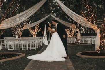 groom and bride standing on narrow pathway