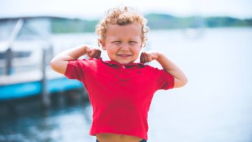 boy standing near dock