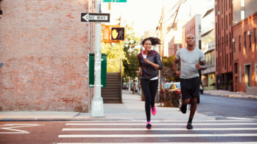 young black couple jogging in brooklyn street