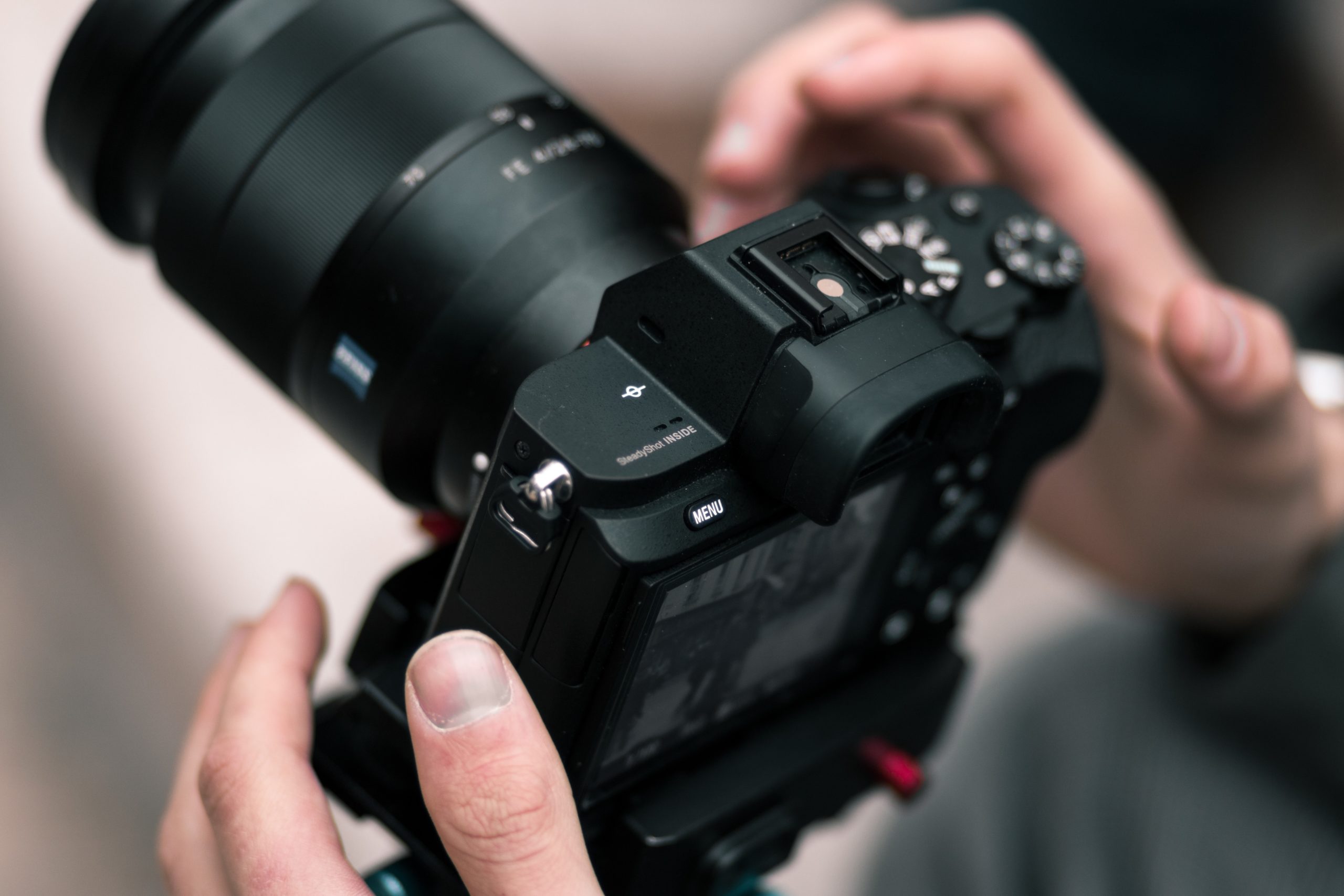 person holding black dslr camera