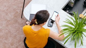 woman in yellow shirt sitting on chair