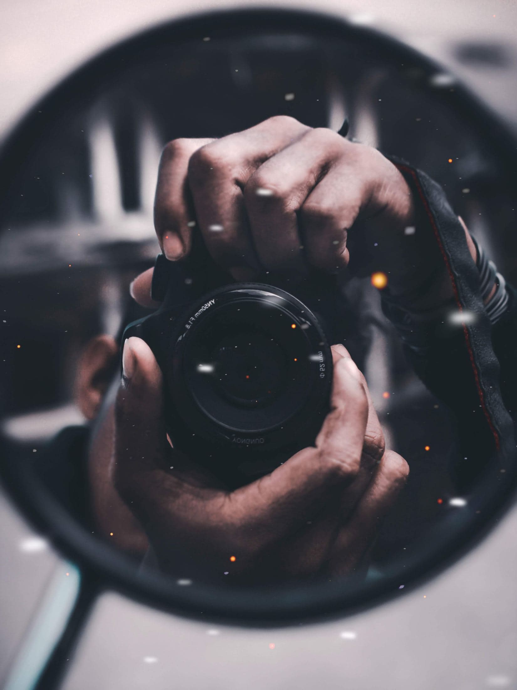 person holding black dslr camera