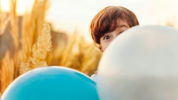 woman hiding on balloon