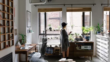 a living room filled with furniture and a large window