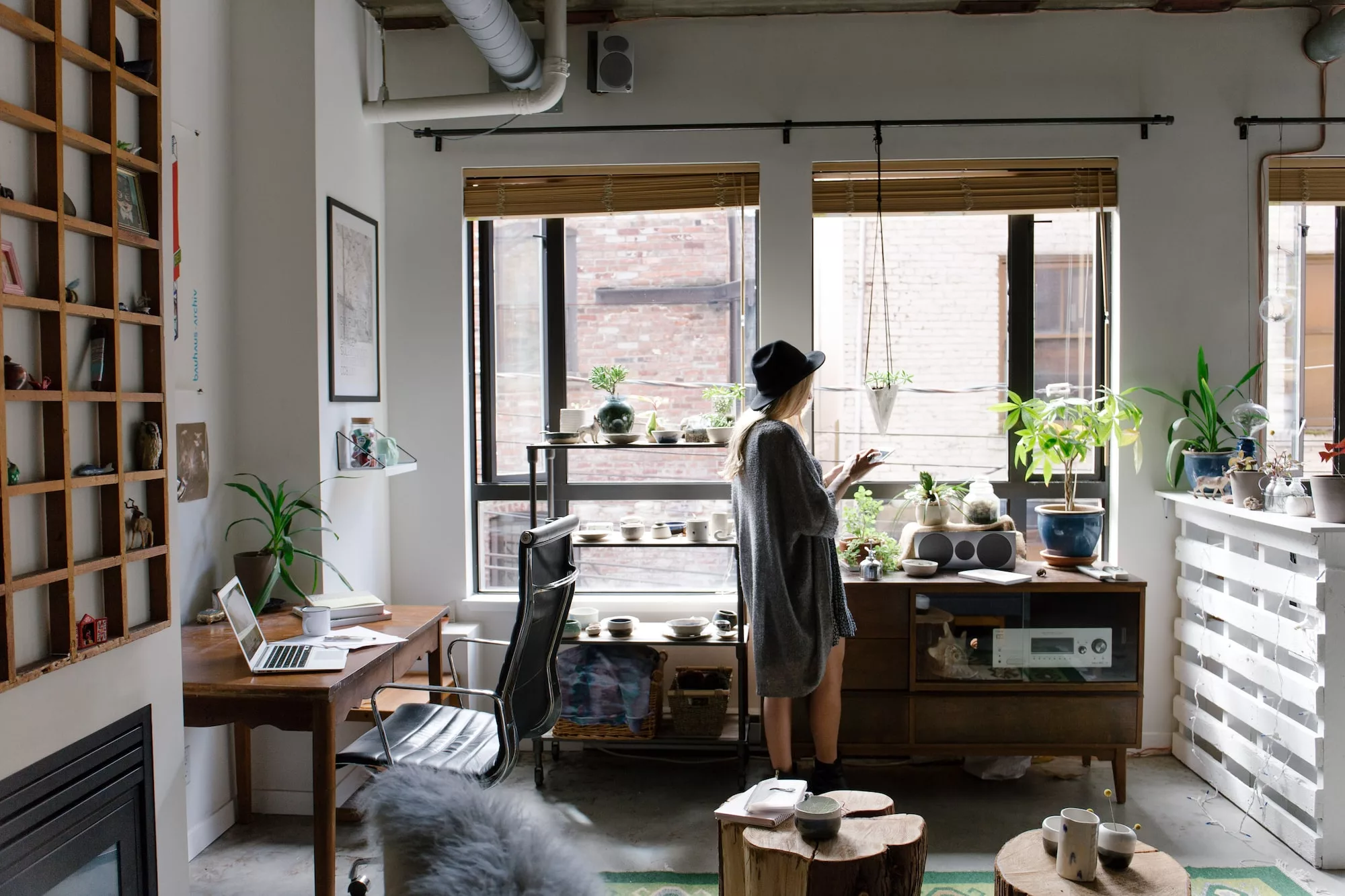 a living room filled with furniture and a large window