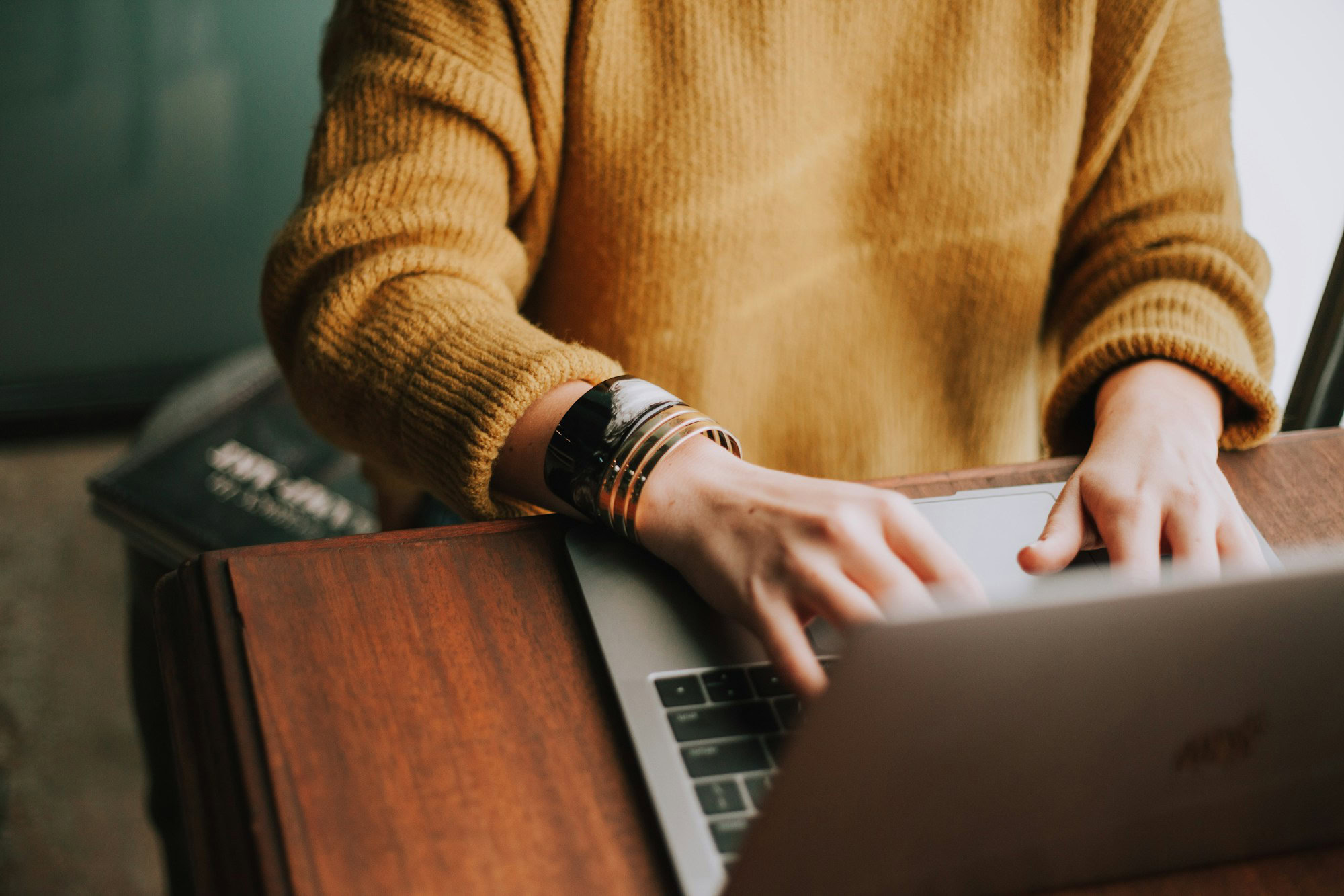 Economical Elegance: The Traveller’s Guide to Cost-Effective Airport Accommodations person using laptop computer