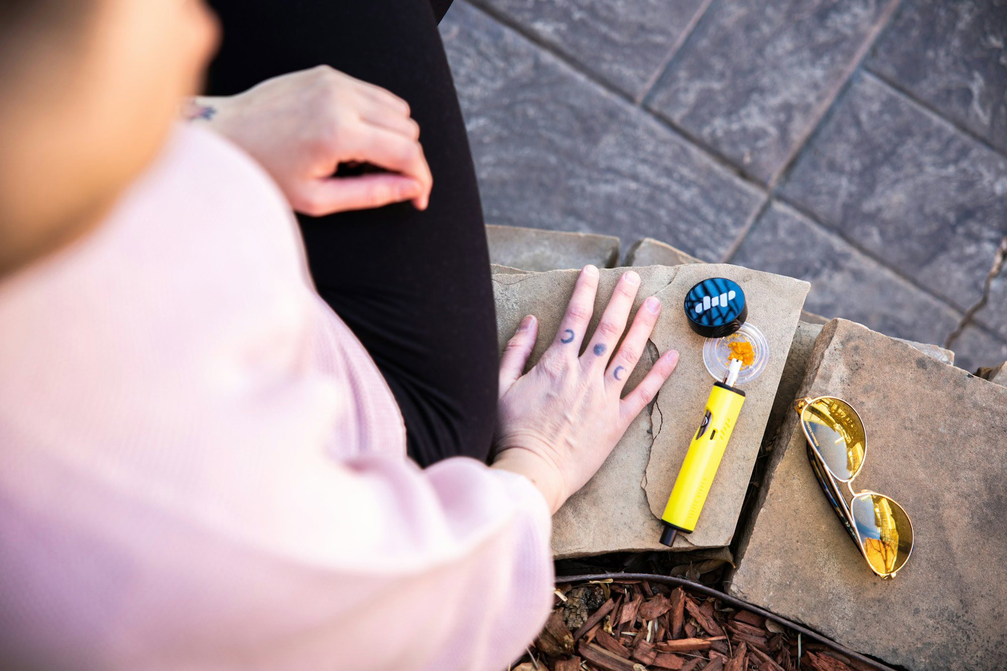 Exploring the World with Ease: How Portable Vaporizers Enhance Travel Experiences a person holding a pair of scissors
