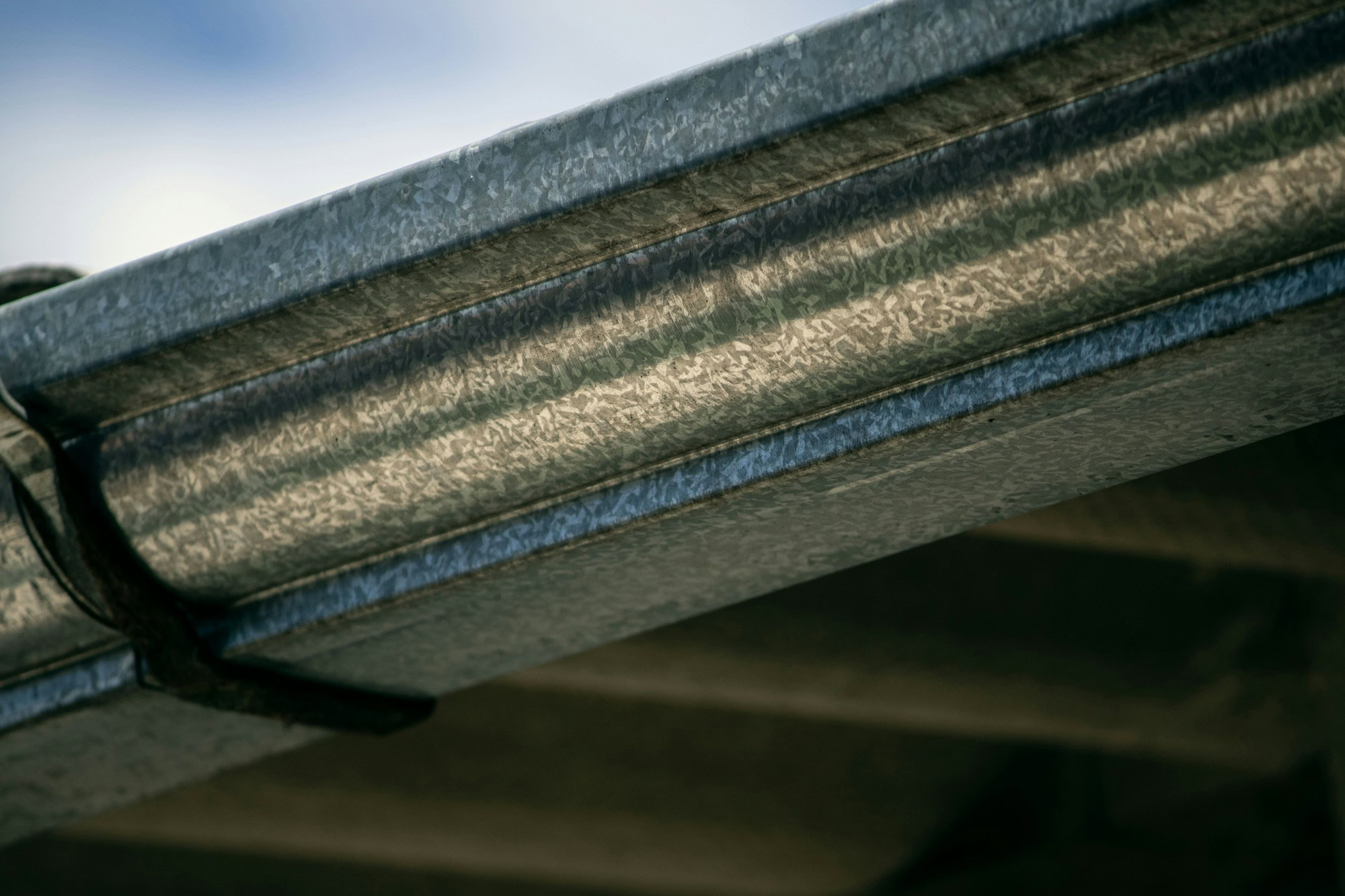 Best Gutter Cleaning Companies in Norwich a close up view of a metal gutter