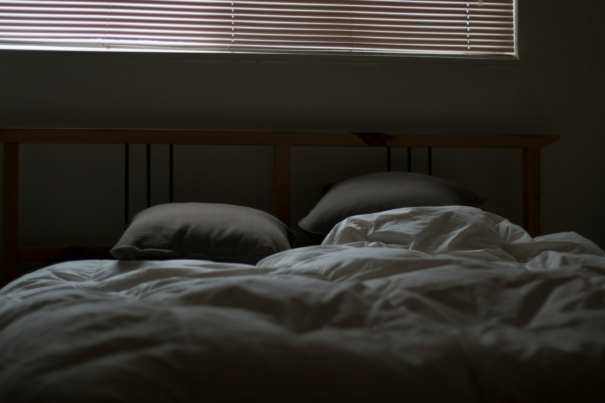 Unique Things To Try If Insomnia Is Taking Over Your Life empty white and gray bed set