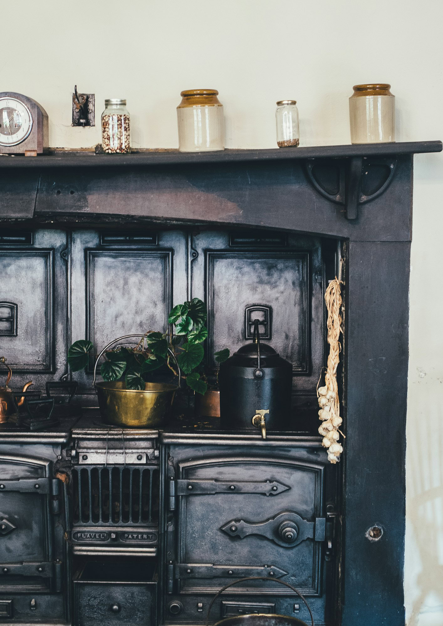 5 Top Tips for Styling Your Kitchen in Spring Time brown wooden kitchen shelf with ceramic jars on top