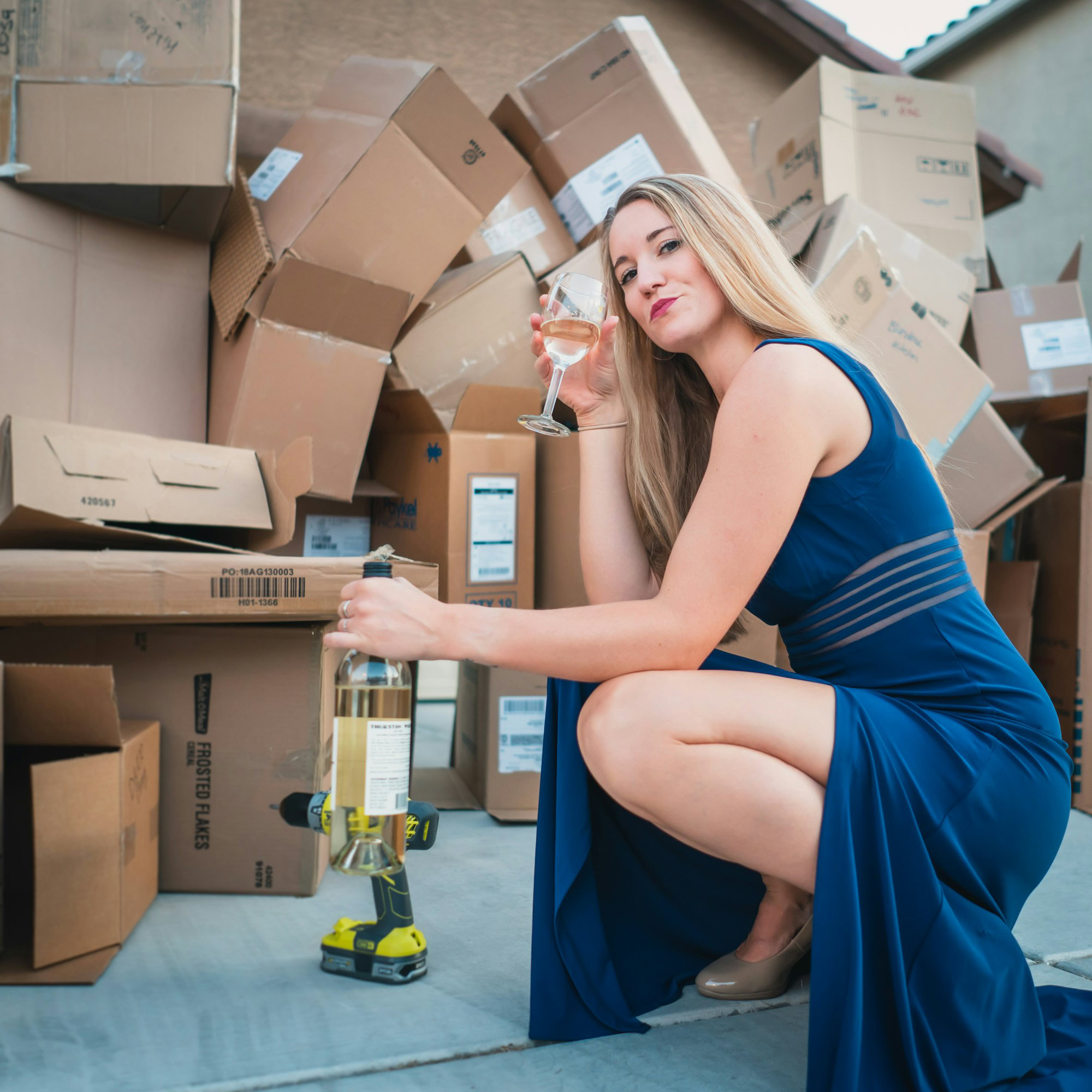 Common Myths About Packers and Movers Debunked woman in blue sleeveless dress sitting on brown cardboard box