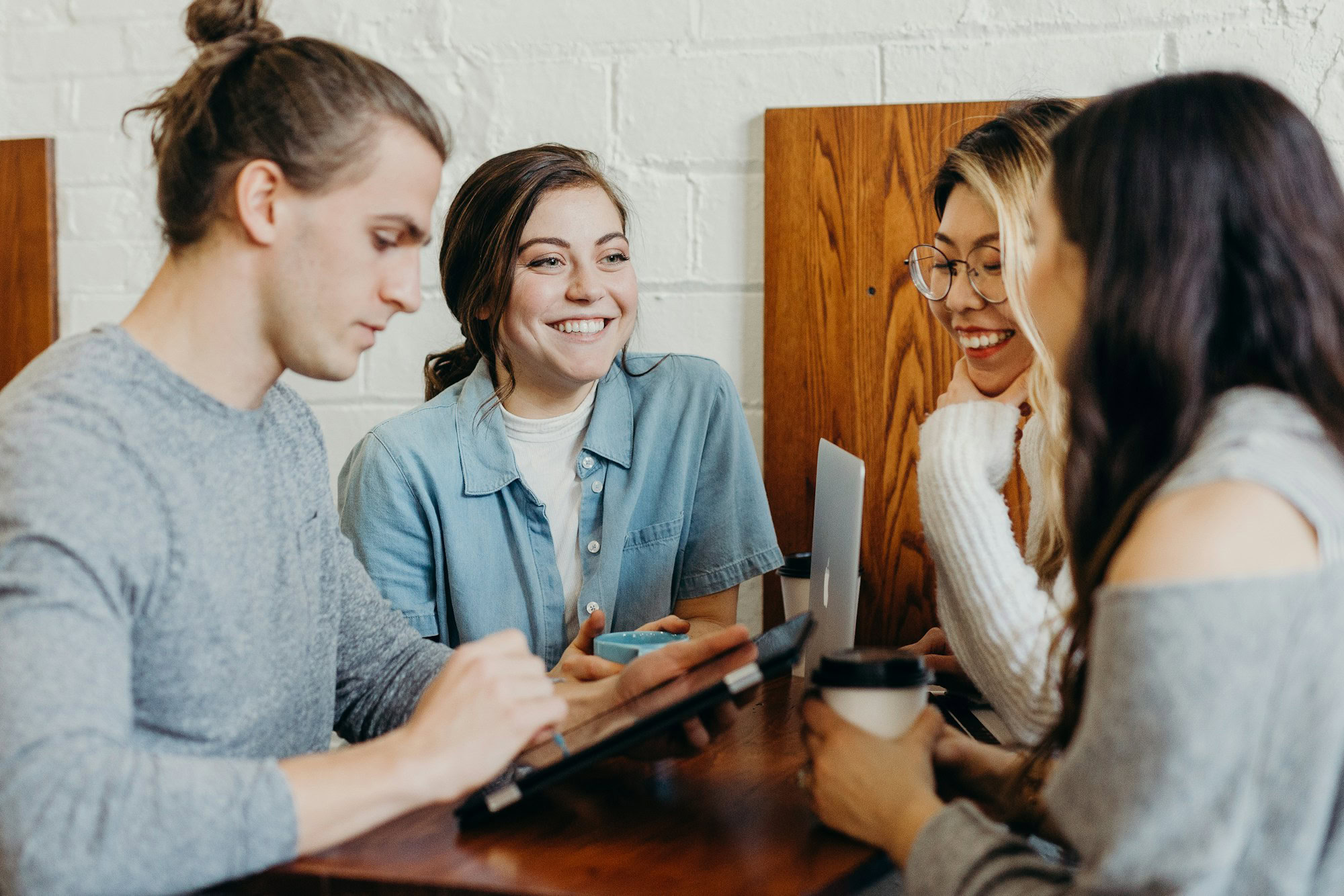 Building a Strong Sales Culture in Your Real Estate Team a group of friends at a coffee shop