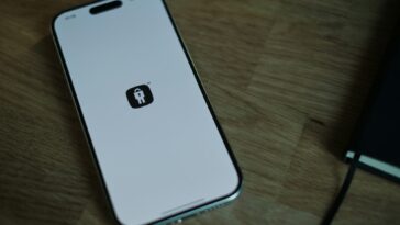 a close up of a cell phone on a table